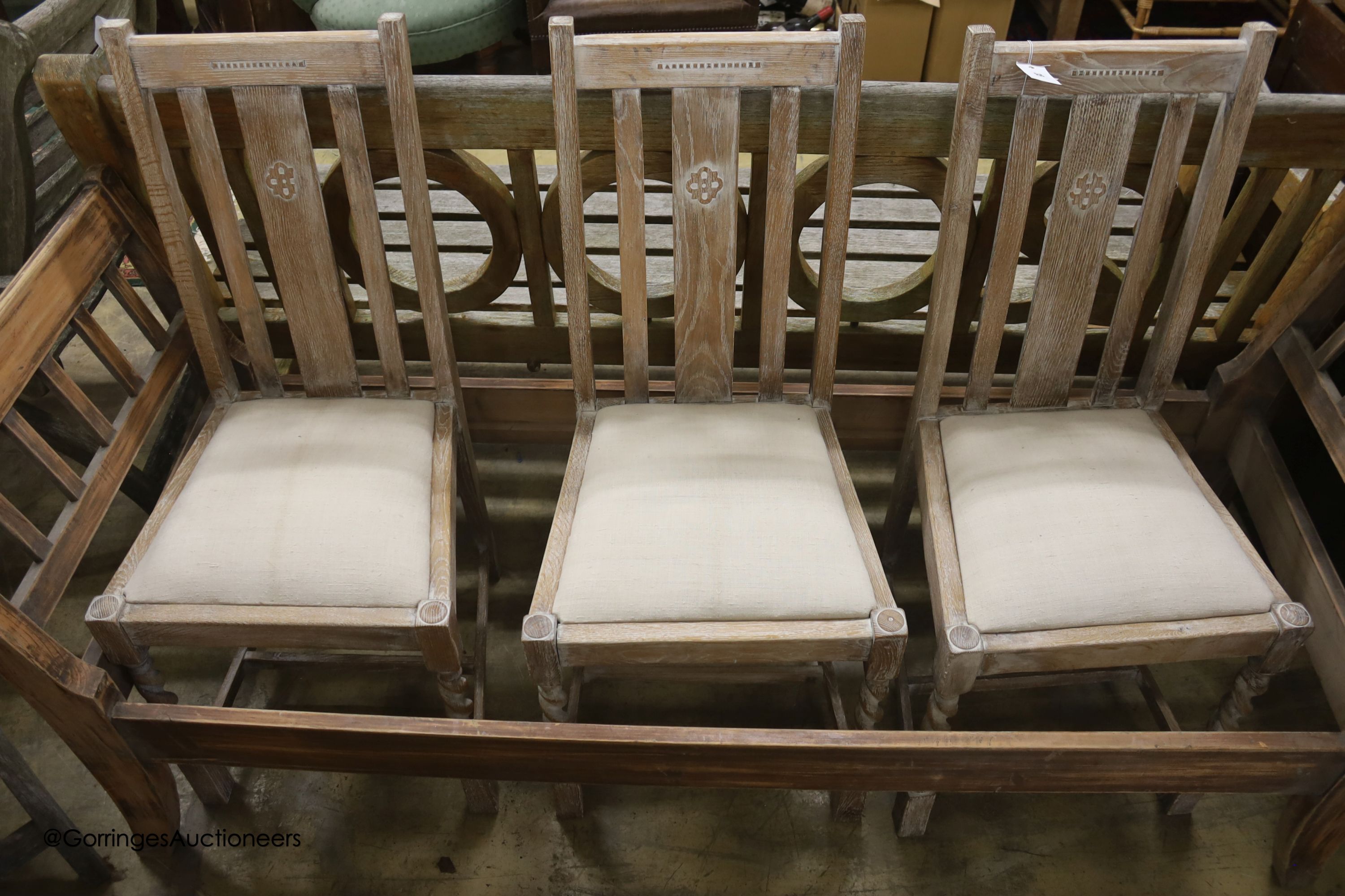 A set of four 1920's limed oak dining chairs